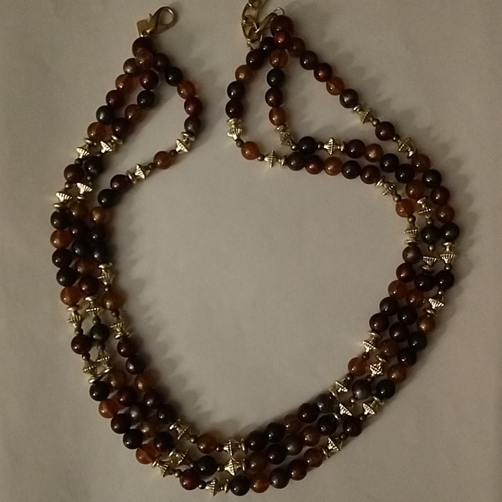 L R triple strand brown and gold tone bead necklac